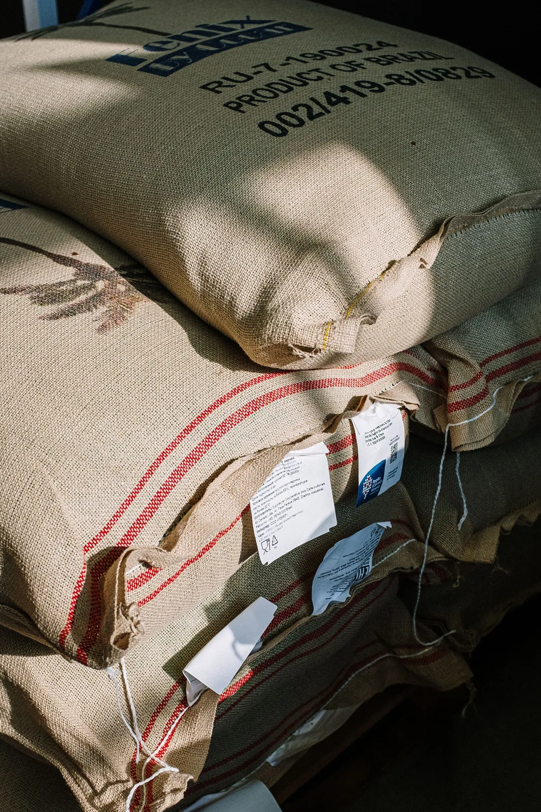 Stacked jute sacks with paper labels